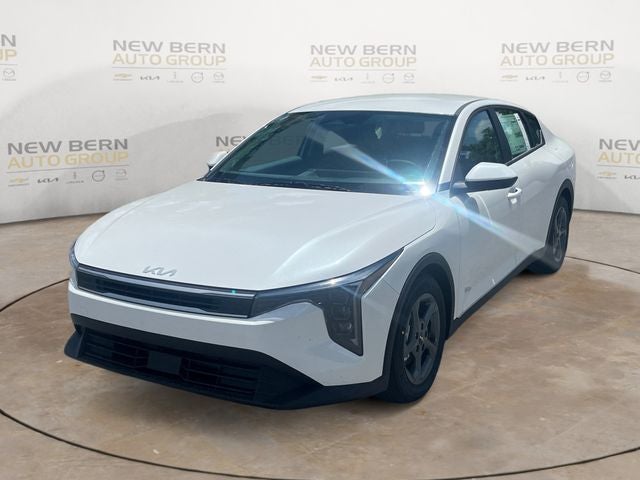 2026 Kia K4 LXS in Snow White Pearl — front three-quarter view