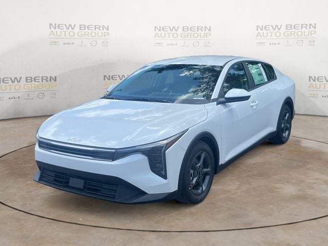 2026 Kia K4 LXS in Snow White Pearl — front three-quarter view