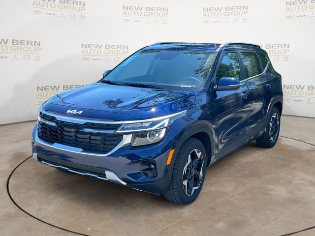 2026 Kia Seltos EX in Dark Ocean Blue — front three-quarter view