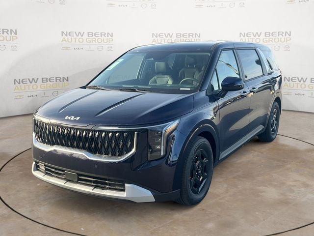 2026 Kia Carnival LXS in Deep Chroma Blue — front three-quarter view