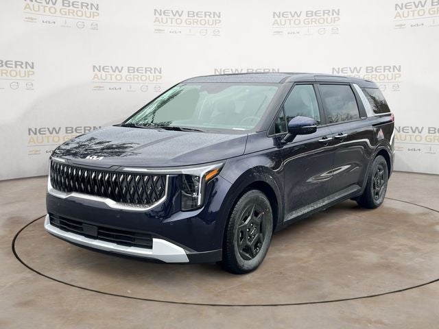 2026 Kia Carnival LXS in Deep Chroma Blue — front three-quarter view