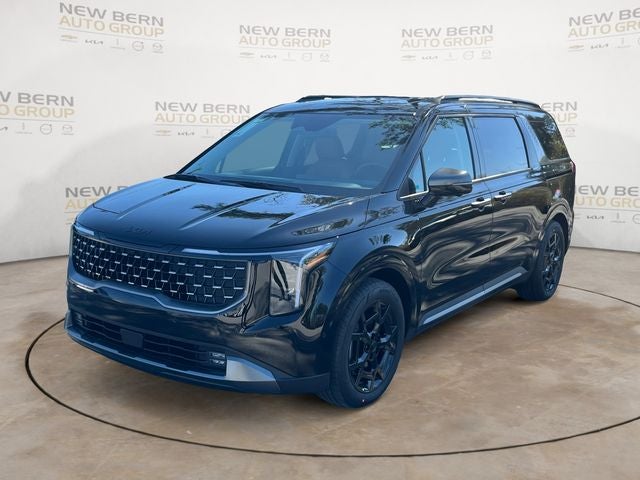 2026 Kia Carnival SX in Aurora Black Pearl — front three-quarter view