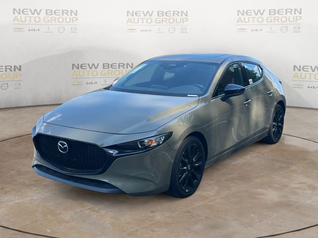 2025 Mazda Mazda3 Hatchback 2.5 Turbo Carbon AWD in Zircon Sand Metallic — front three-quarter view